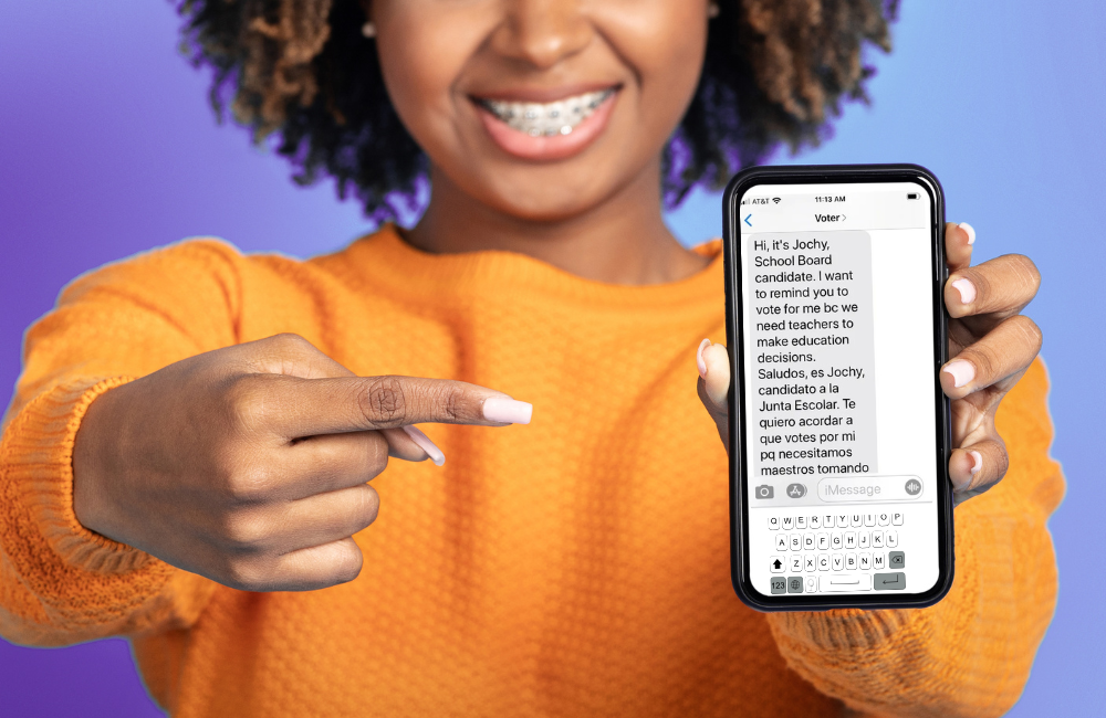 Smiling woman holding phone